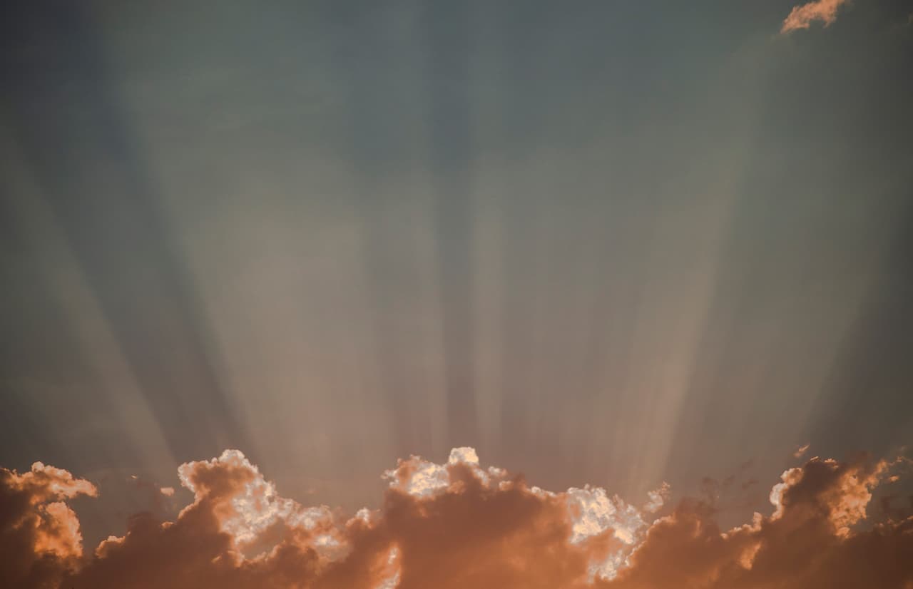 Sun Rays Coming Out Of Clouds Like God Appearing
